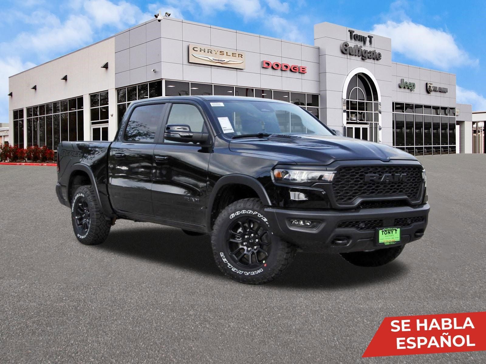 2026 RAM 1500 Rebel 4x4 Crew Cab 5'7" Box in Diamond Black Crystal Pearlcoat — front three-quarter view