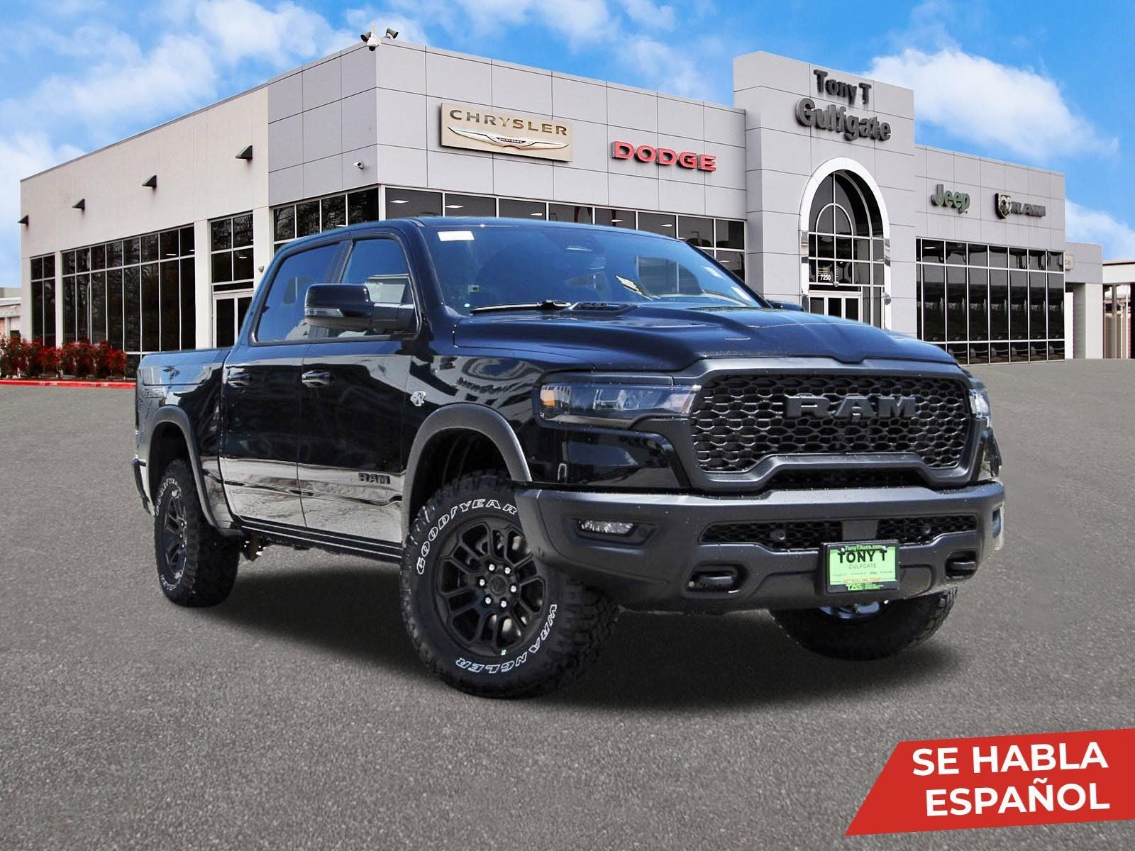 2026 RAM 1500 Rebel 4x4 Crew Cab 5'7" Box in Diamond Black Crystal Pearlcoat — front three-quarter view